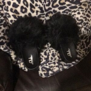 Black fuzzy with thick heel sandal.  Wear inside or outside.  Eye catcher